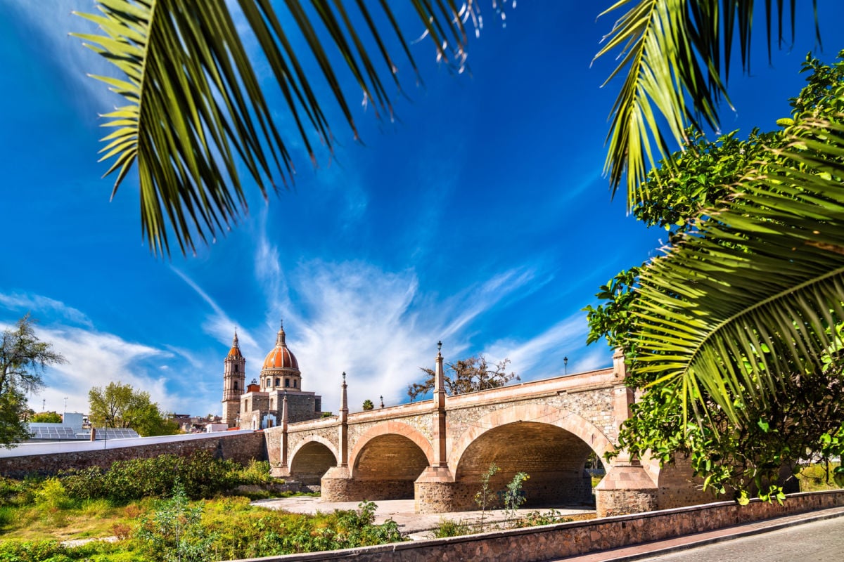 Old colonial bridge and Parish of the Light in Lagos de Moreno