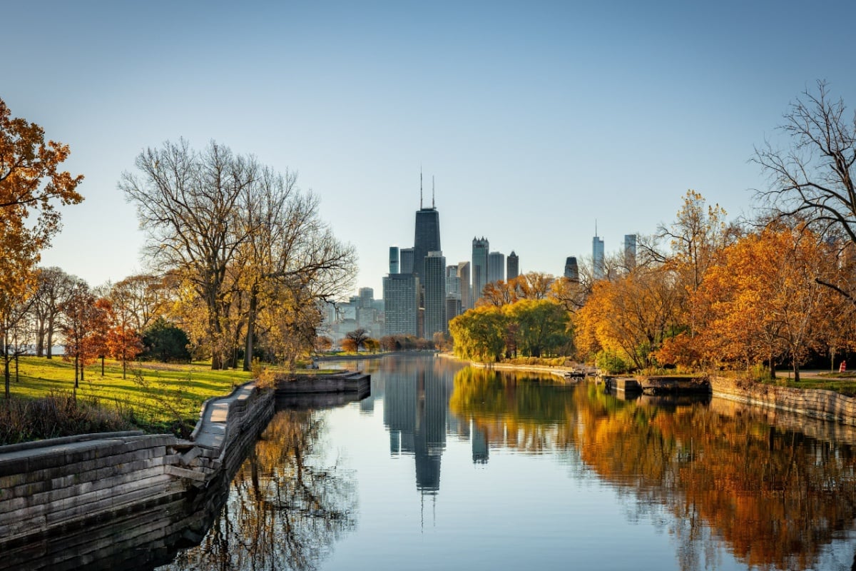 Chicago skyline reflected in canal during fall season